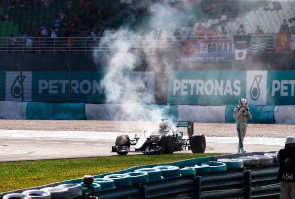 Lewis Hamilton walks away from his smoking car. Copyright Mercedes AMG F1 Team.